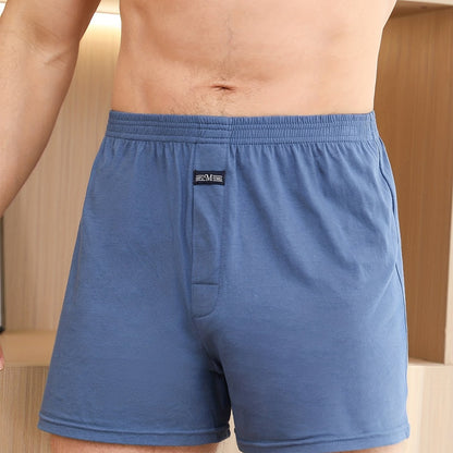 Calça de homem em algodão puro com estampado de flechas, larga, ideal para pijamas, de cintura subida e com gancho profundo.