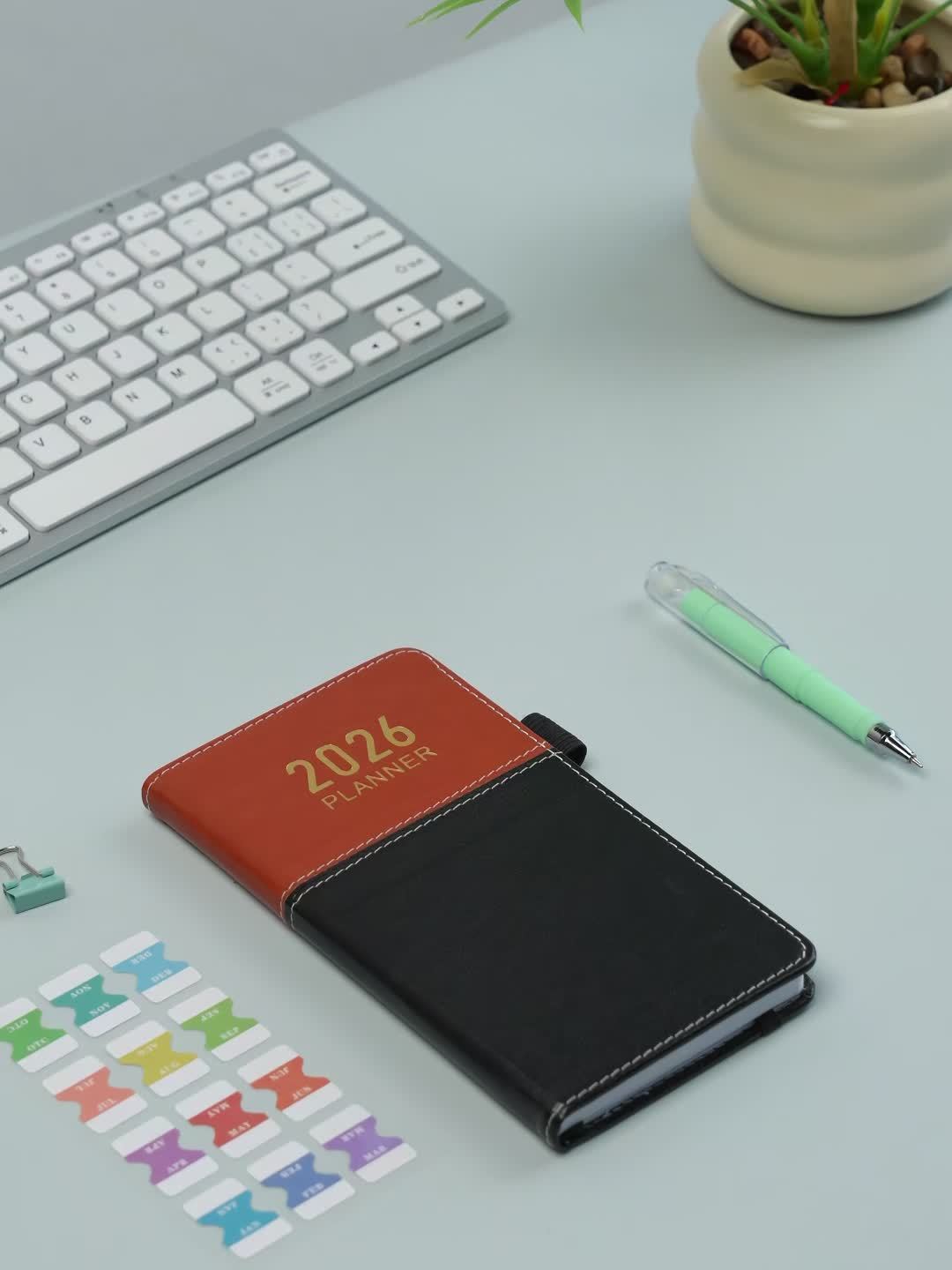 2026 Compact Planner, January 2026 to December 2026. Small monthly and weekly calendar, wallet size, 9.65 cm x 17.78 cm, with elastic band and pen loop, suitable for homeschooling or a Halloween gift.