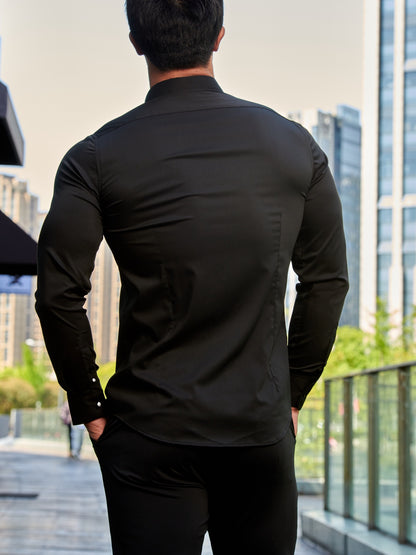 Camisa de homem de manga comprida, corte slim, cor sólida, tecido elástico de secagem rápida e fecho de botões. Ideal para atividades físicas na primavera e no outono.