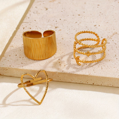 Conjunto de 5 e 6 anéis ajustáveis ​​em aço inoxidável dourado com formato de coração, estrela e lua para mulher. Anéis de metal estilo hip-hop, perfeitos como acessórios para oferecer. Joias estilo K-pop.