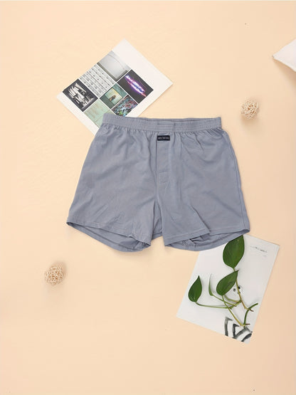 Calça de homem em algodão puro com estampado de flechas, larga, ideal para pijamas, de cintura subida e com gancho profundo.