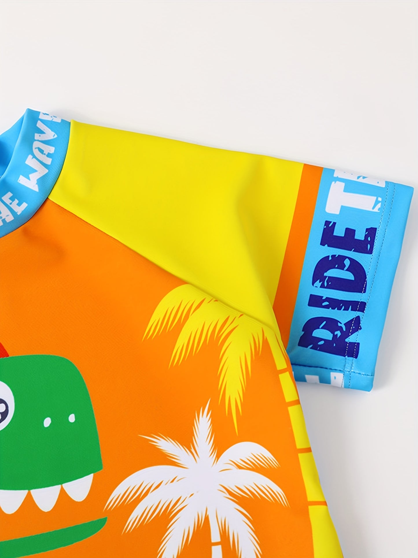 Boys' Dinosaur "Ride the Wave" Swimsuit Set with Matching Cap - Stretchy, Quick-Dry Polyester/Elastane Blend, Crew Neck Top & Shorts for Youngsters - Colorful Cartoon Design, Machine Washable