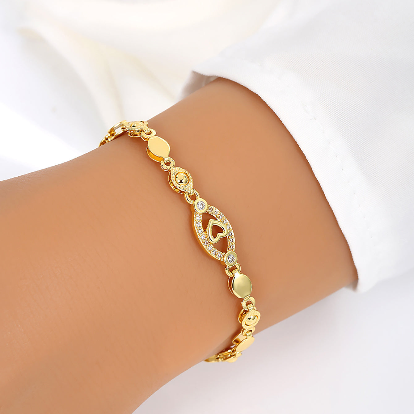 Elegant 18K Golden Plated Copper Bracelet with Synthetic Cubic Zirconia, Heart and Leaf Motif Openwork Design for Daily Wear and Special Occasions